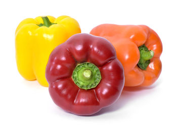 Close-up of bell peppers against white background