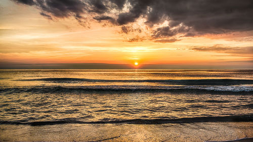 Scenic view of sea against sky during sunset