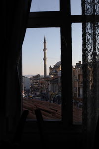 View of city buildings seen through window