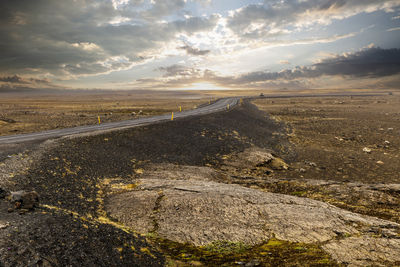 Scenic view of beach against sky during sunset