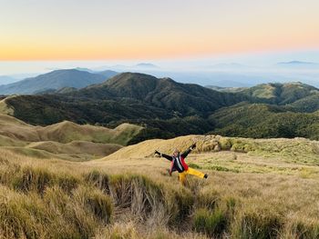 Full length of man on field against mountain range