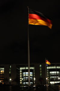 Low angle view of illuminated building at night