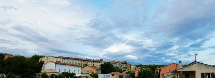 Low angle view of houses against sky