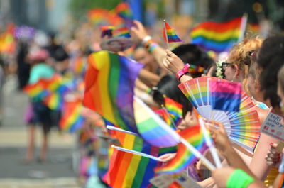 Rainbow flag on street of new york city during nyc pride parade.