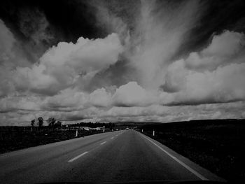 Road against storm clouds