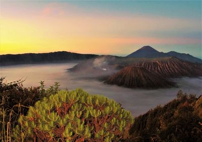 View of volcanic landscape against sky during sunset