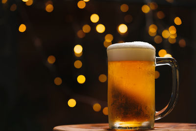 Close-up of beer glass on table