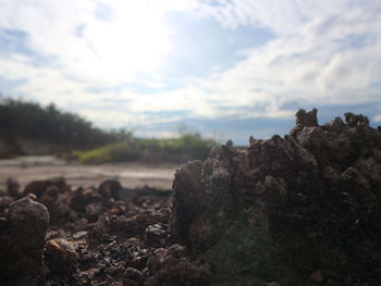 Rocks on land against sky