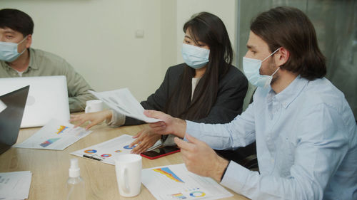 Group of people working on table