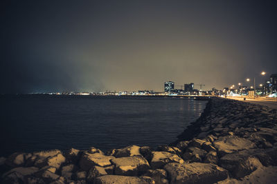 Scenic view of sea against sky at night