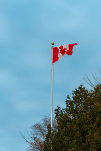 Low angle view of flag against sky