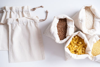 Reusable eco-friendly fabric bags for storage or shopping with various agricultural cereals