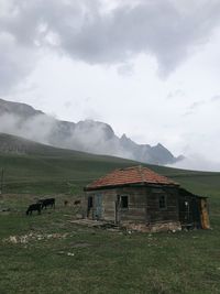 House on field against sky