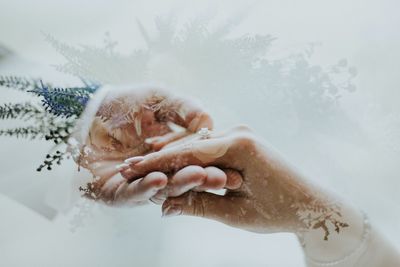 Cropped image of person washing hands