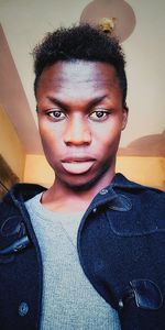 Close-up portrait of young man at home