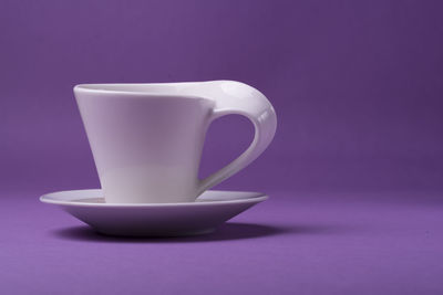 Close-up of coffee cup on table