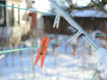 Close-up of clothespins hanging on clothesline