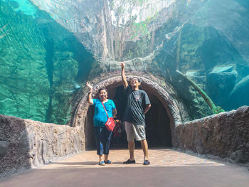 People standing on rock