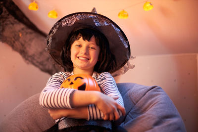 Halloween kids. portrait of a cute girl in a witch costume. tricks or treats.