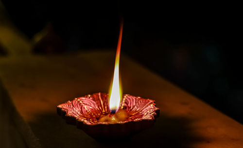 Close-up of lit candles on birthday cake