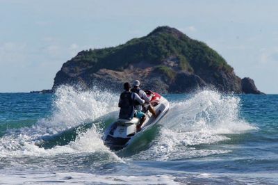 Two people jet boating in sea