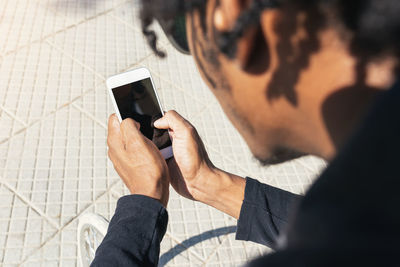 High angle view of man using mobile phone