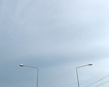 Low angle view of street light against sky