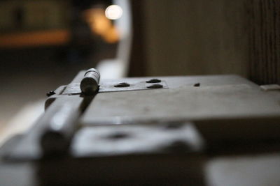 Close-up of electric lamp on table at home