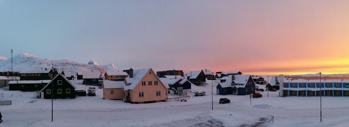 Panoramic view of snow covered landscape against sky