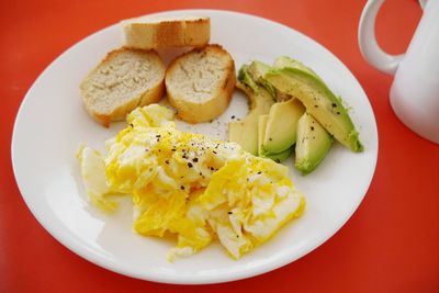 Directly above shot of breakfast served on red background