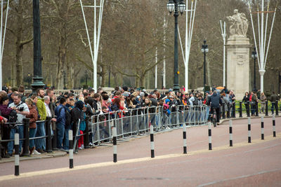 Tourists watching the changing the guards military parade, buckingham palace
