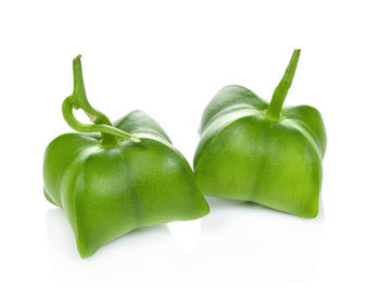 Close-up of green pepper against white background