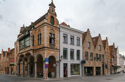 Low angle view of building against cloudy sky