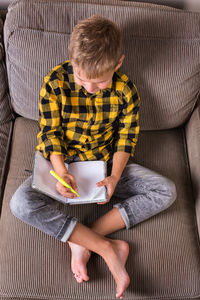 High angle view of boy sitting