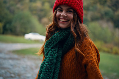 Portrait of smiling young woman in winter