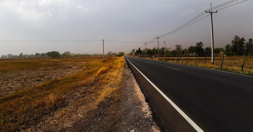 Empty road against sky