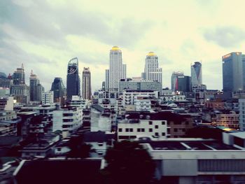 Modern buildings in city against sky