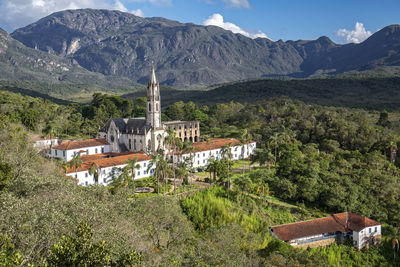 High angle view of townscape and mountains against sky