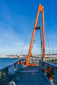 A view of an orange architectural arch at jack block park in west seattle, washington.