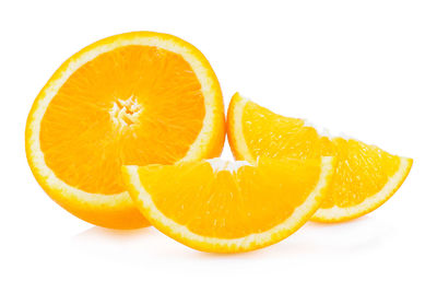 Close-up of orange fruits against white background