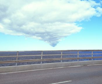 Road by sea against sky