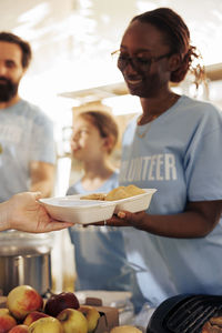Portrait of young man preparing food at home