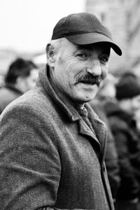 Portrait of man wearing hat standing outdoors
