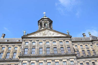 Low angle view of building against blue sky