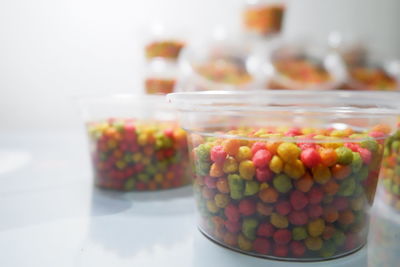 Close-up of candies in glass jar on table