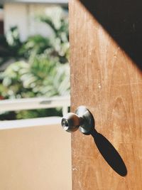 Close-up of key on wooden door