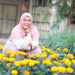 Portrait of young woman in sunflower