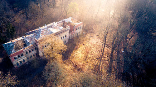 High angle view of old abandoned building in forest