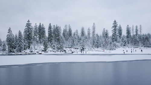 Scenic view of frozen lake against sky during winter