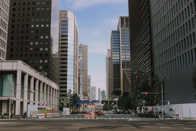 City street amidst buildings against sky